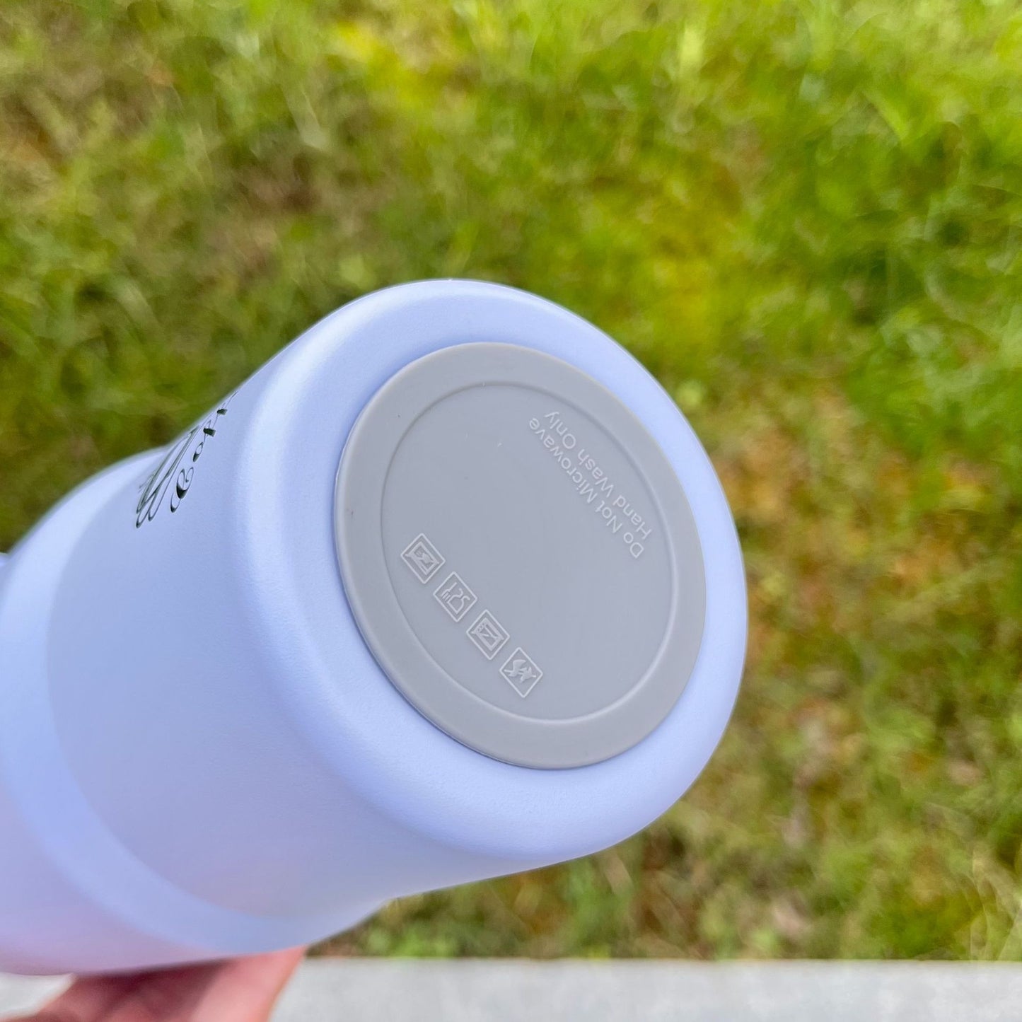 Light blue bottle base showing underside markings