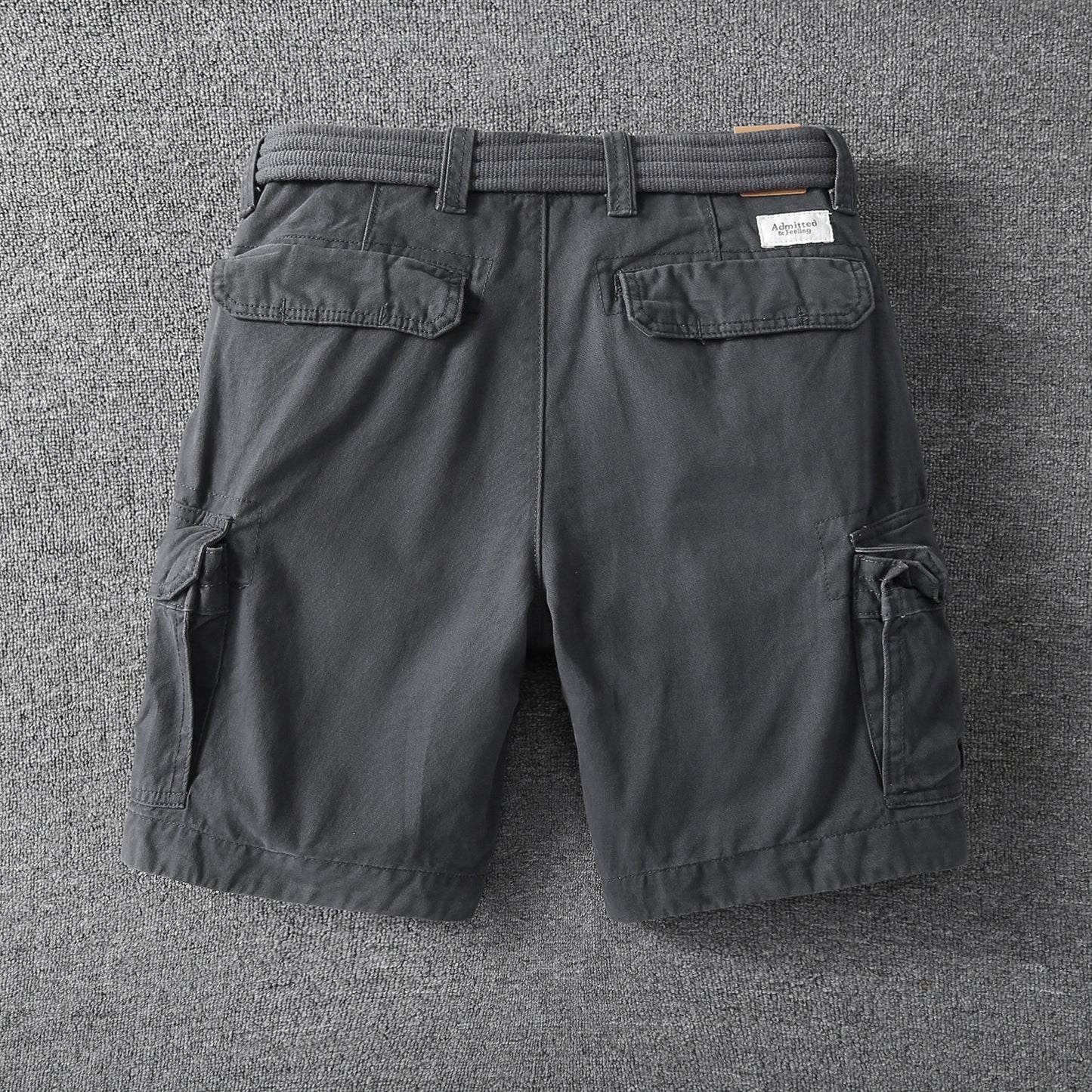 Men's relaxed-fit outdoor shorts in dark gray with side cargo pockets and elastic waist
