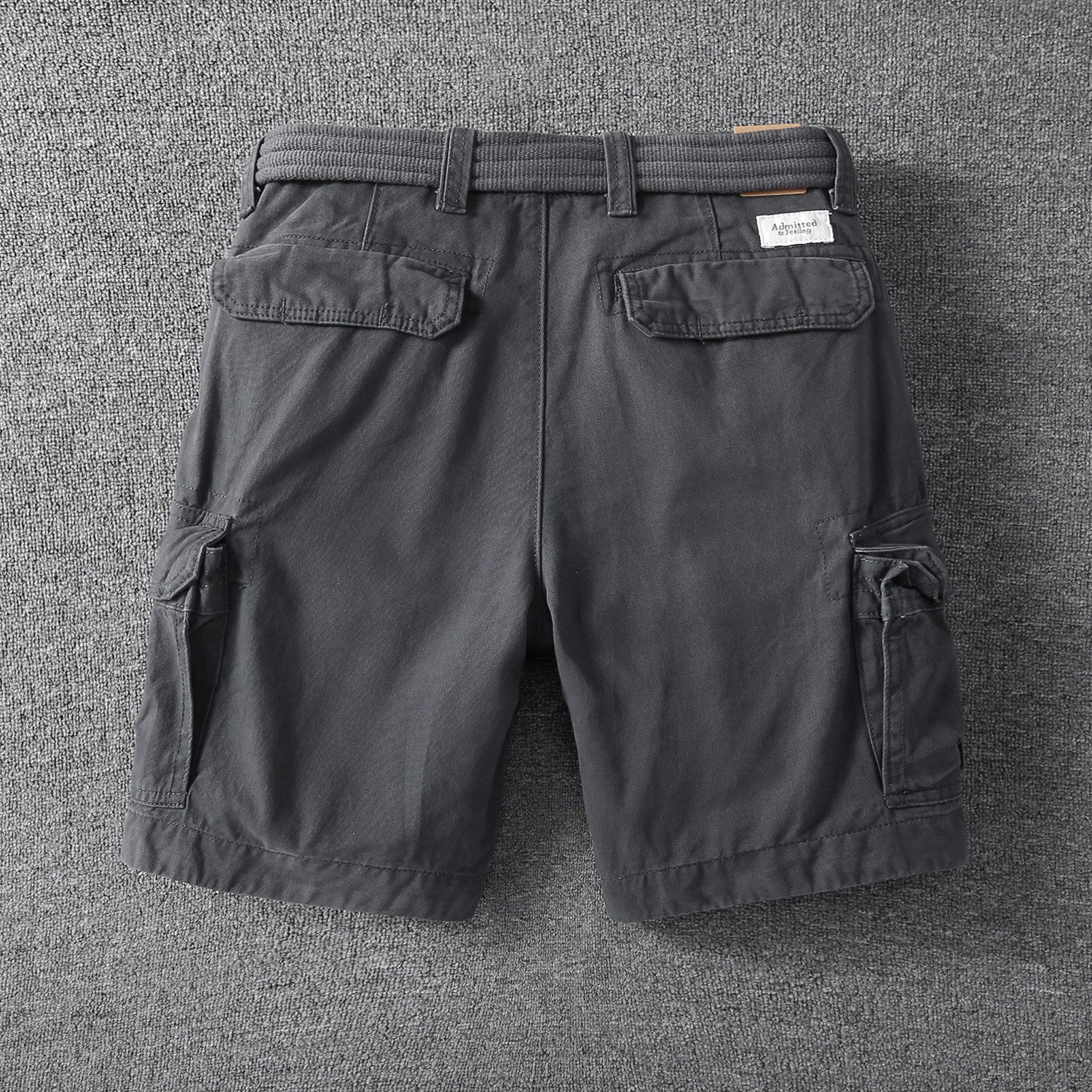 Men's relaxed-fit outdoor shorts in dark gray with side cargo pockets and elastic waist