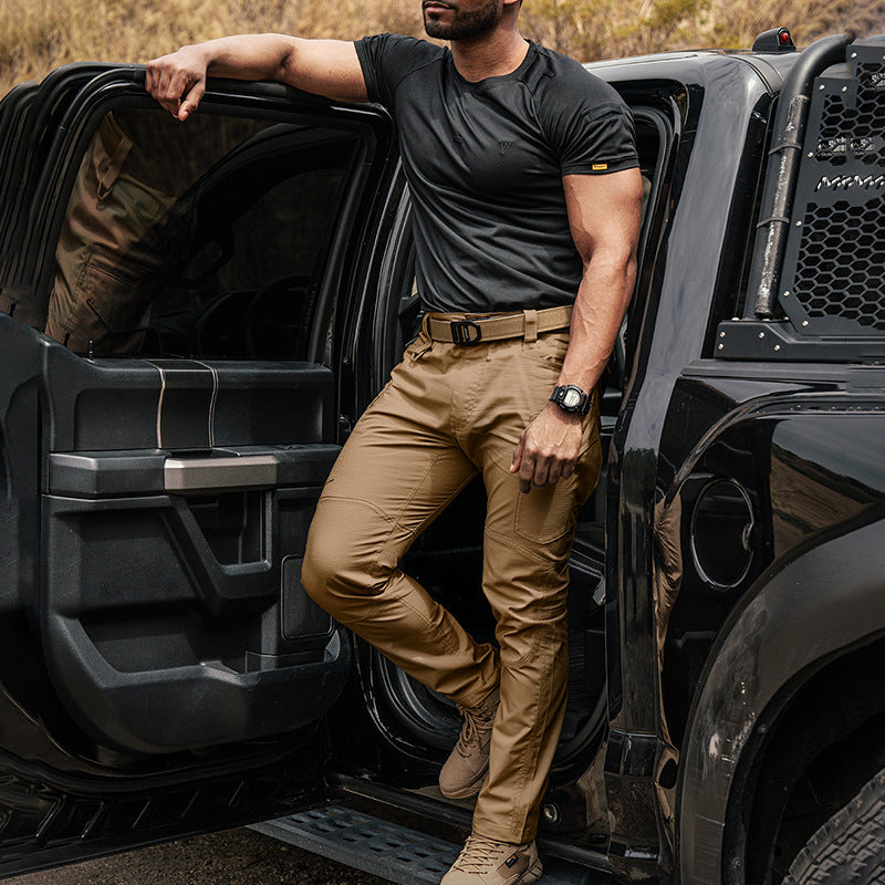 Brown cargo pants with belt loops, front zip, and multiple utility pockets