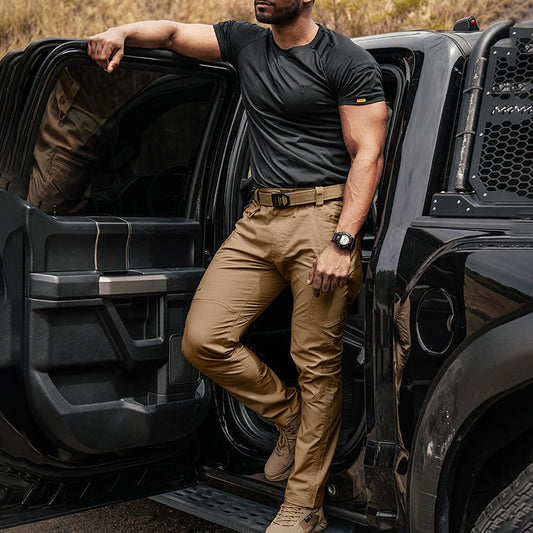 Brown cargo pants with belt loops, front zip, and multiple utility pockets