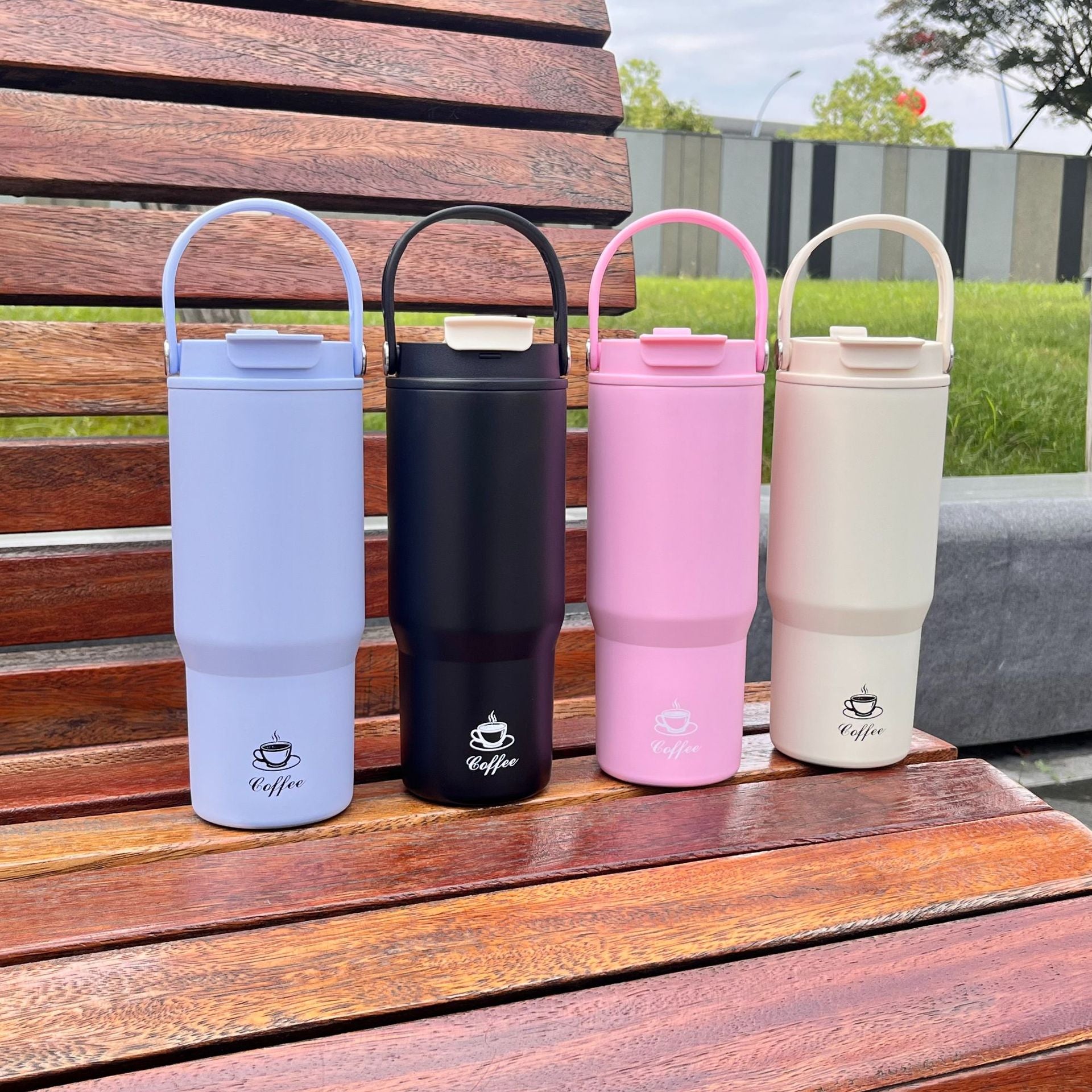Set of portable insulated coffee bottles in light blue, black, pink, and cream, 750ml