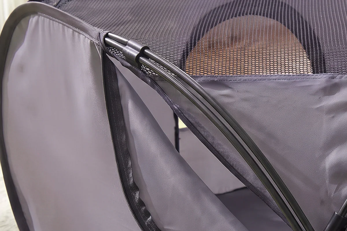 Gray pet playpen tent frame with zipper panels and reinforced metal poles.