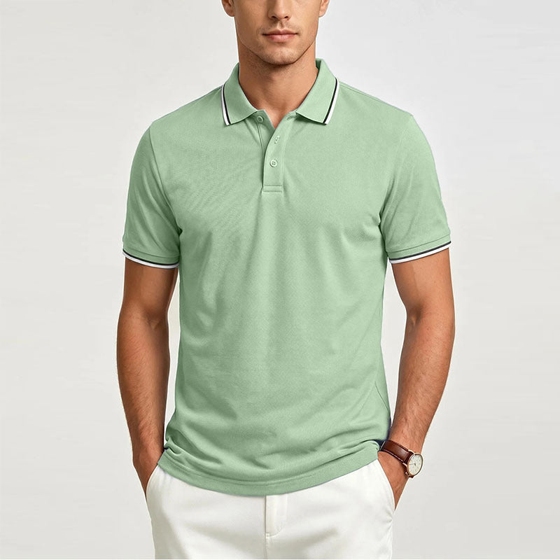 Green men’s short-sleeve polo shirt with button placket and contrasting collar trim.