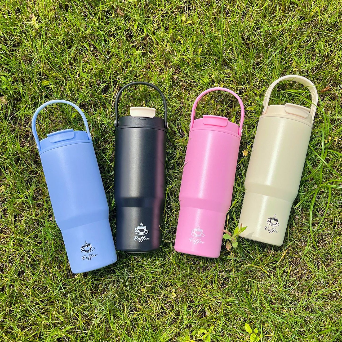 Portable stainless steel insulated bottles in pink, blue, dark and cream colors