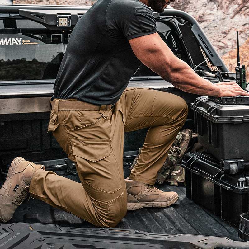 Brown tactical cargo pants with side pockets and reinforced knee panel