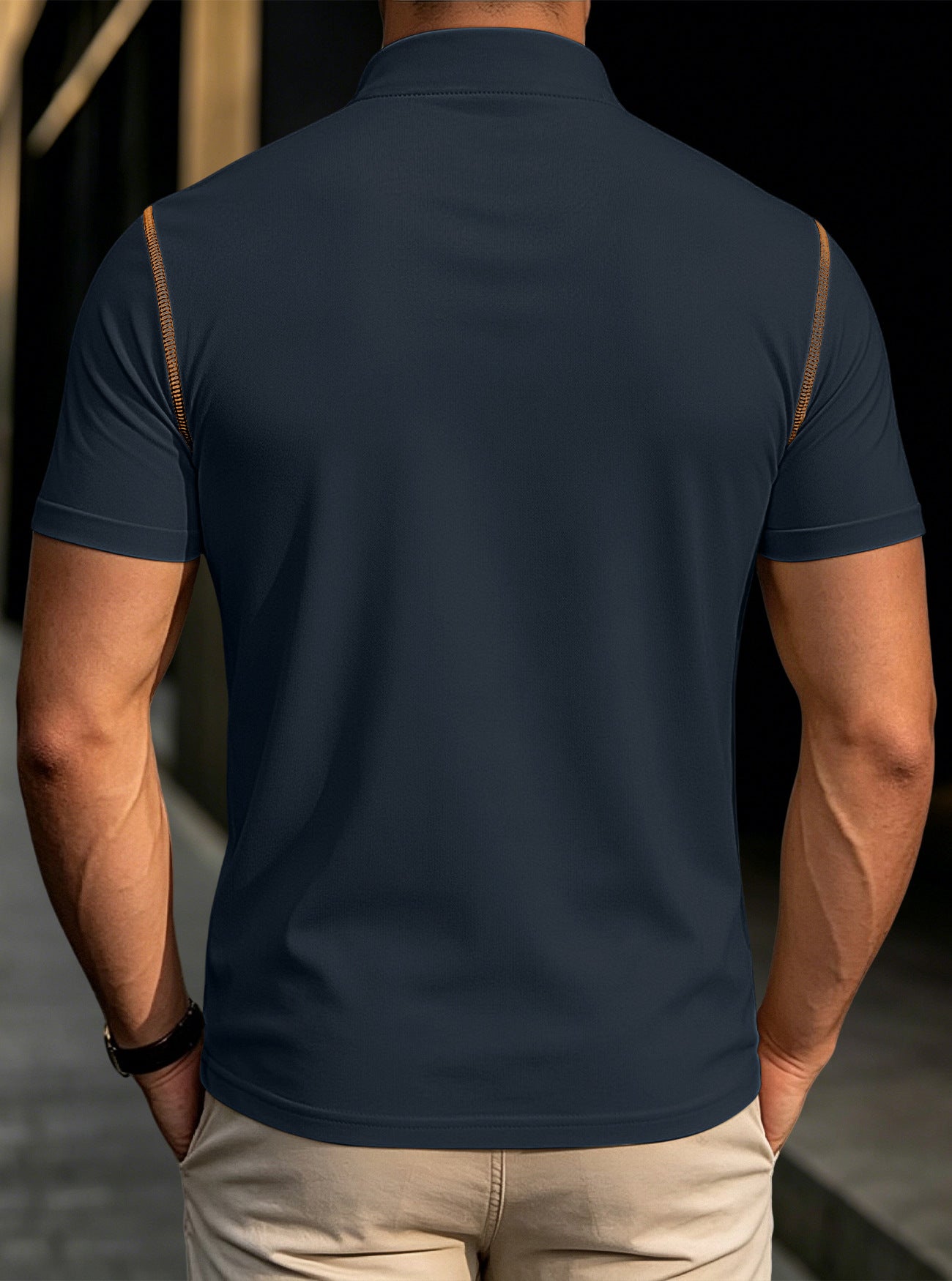Men's dark navy stand-collar henley polo shirt, back view with tan shoulder trim