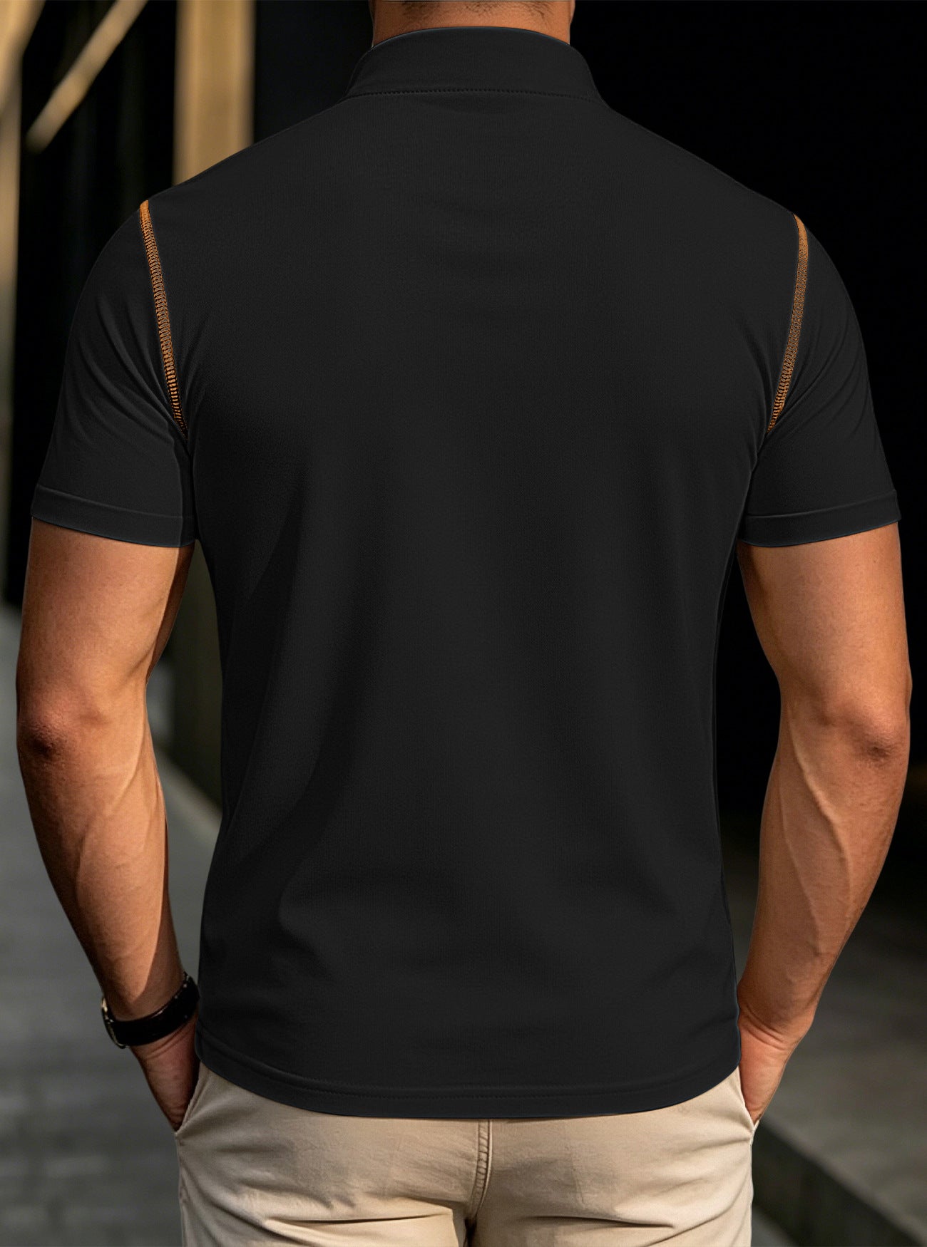 Men's black stand-collar henley polo shirt, back view with tan shoulder trim