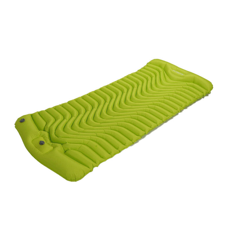 Emerald green inflatable camping sleeping pad with built-in pillow, folded side view