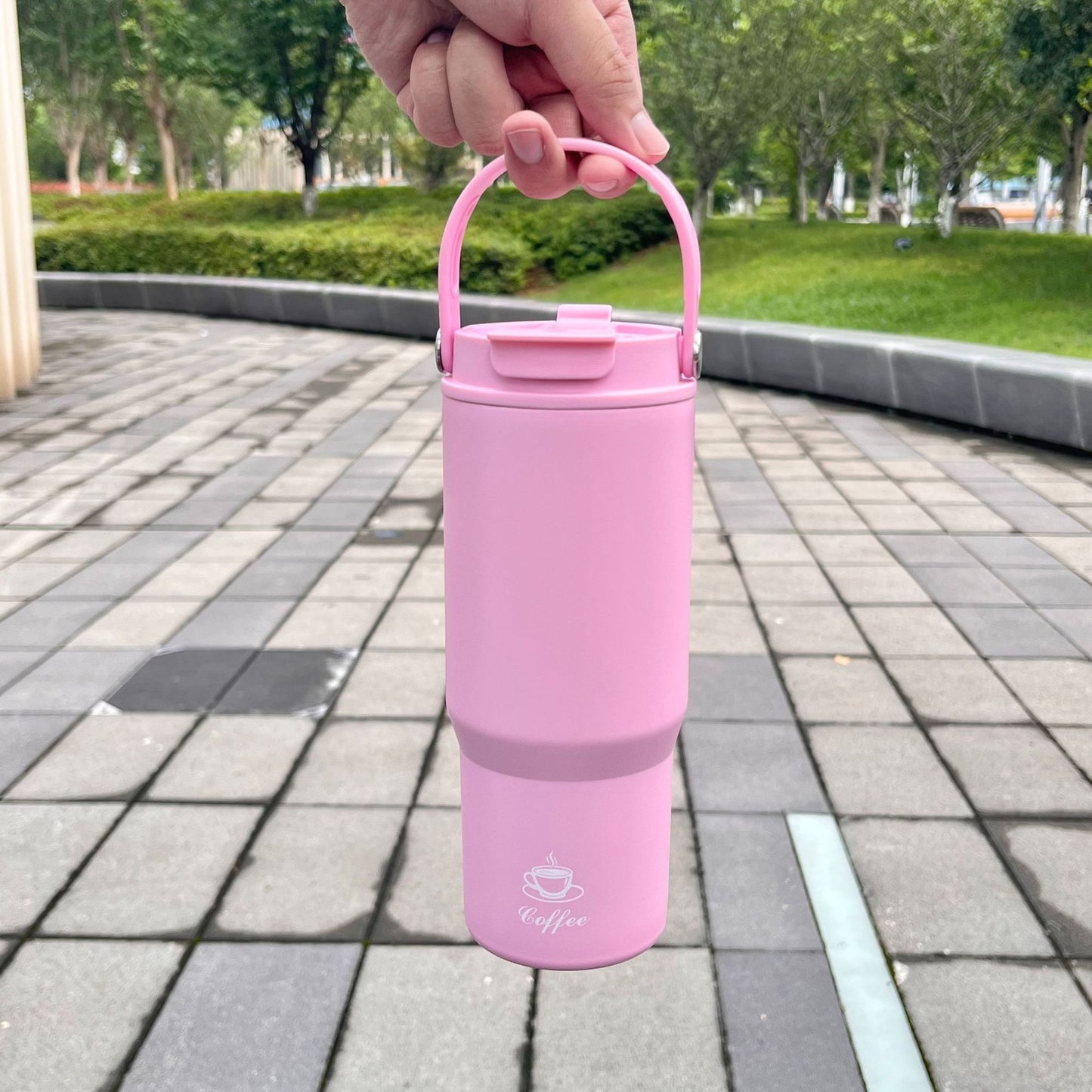 Portable stainless steel insulated bottle, pink, with carry handle and flip lid