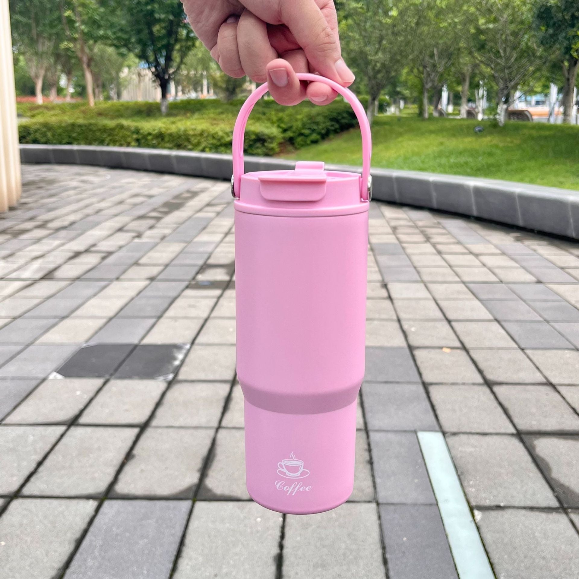Portable stainless steel insulated bottle, pink, with carry handle and flip lid