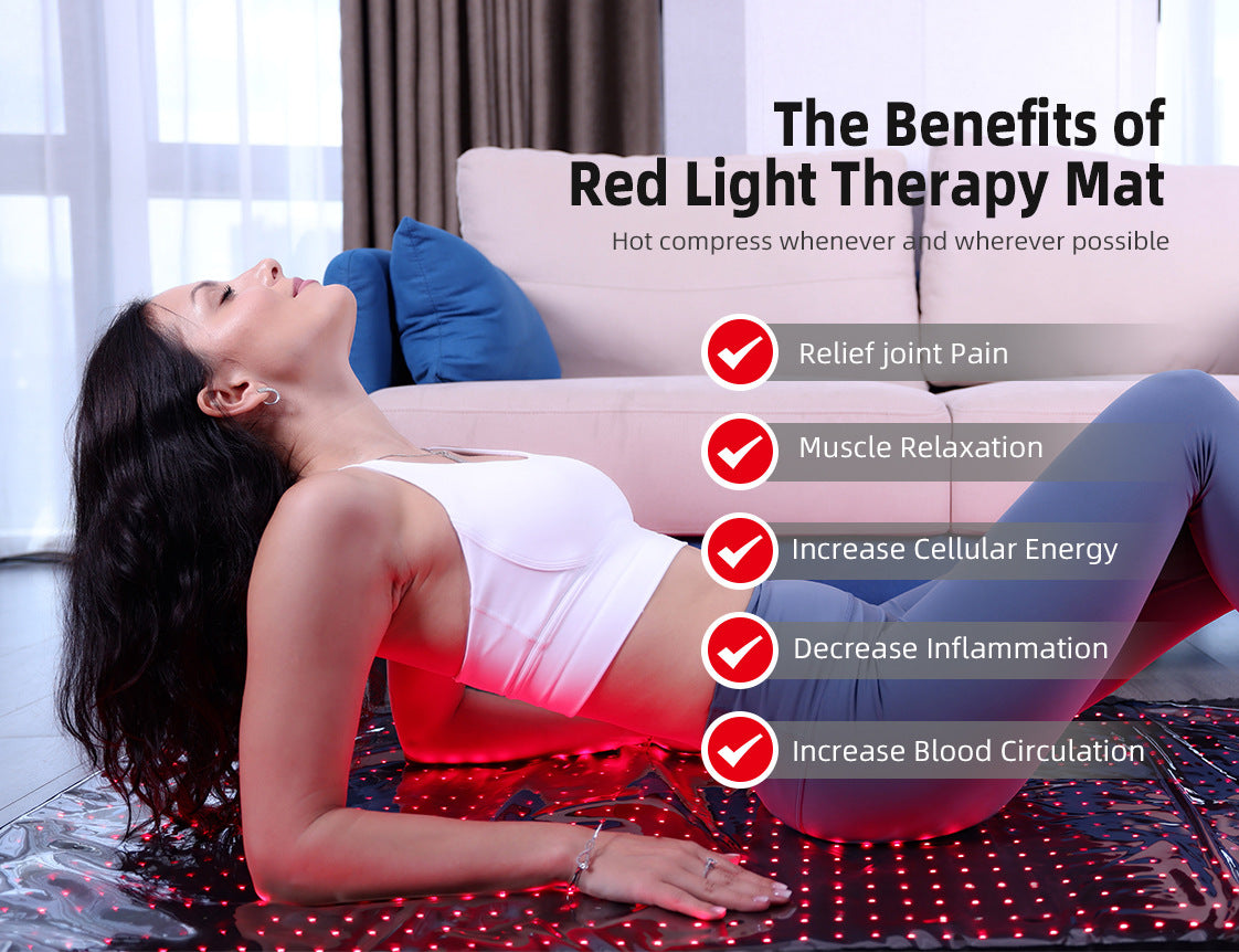 Woman relaxing on infrared light therapy mat with red LED panel glow