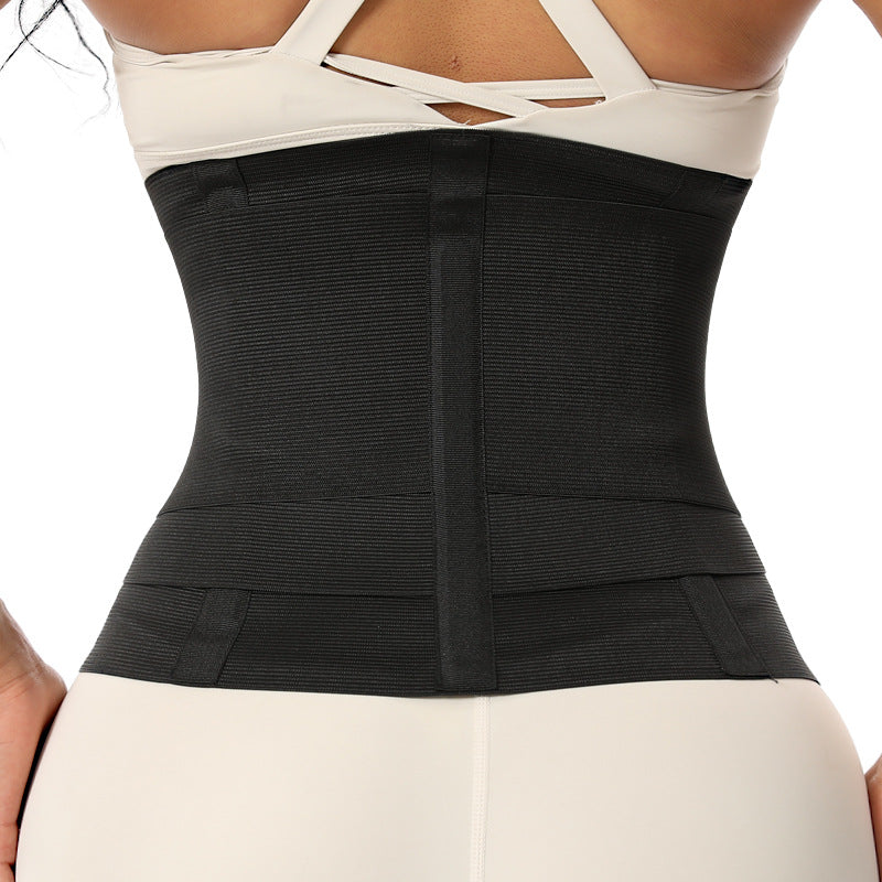 Black waist trainer with front vertical panel and curved shaping panels