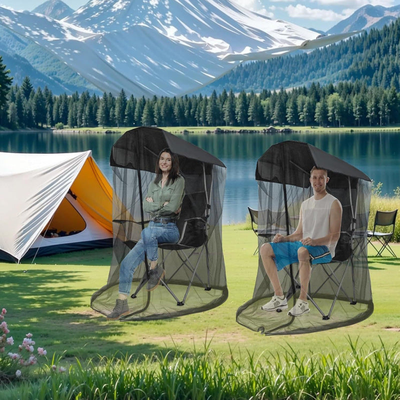 Black pop-up mosquito net tent chair set up on lawn, showing mesh walls and canopy