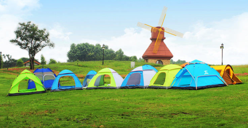 Pop-up camping tent set in blue, green, and lime colors on a lawn