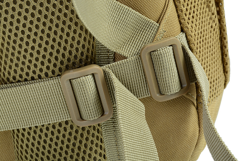 Tan backpack close-up of breathable mesh panel and adjustable strap buckles