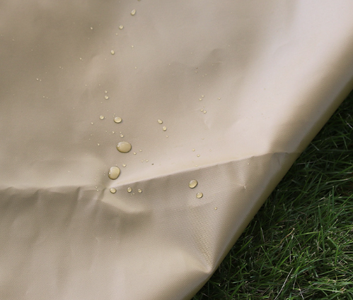 Khaki waterproof mat fabric with visible water droplets beading on the surface