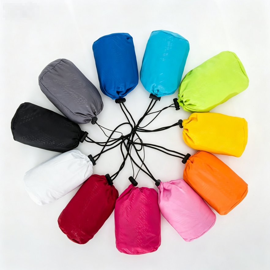 Packable hooded sun protection jackets in assorted colors, folded into pouches