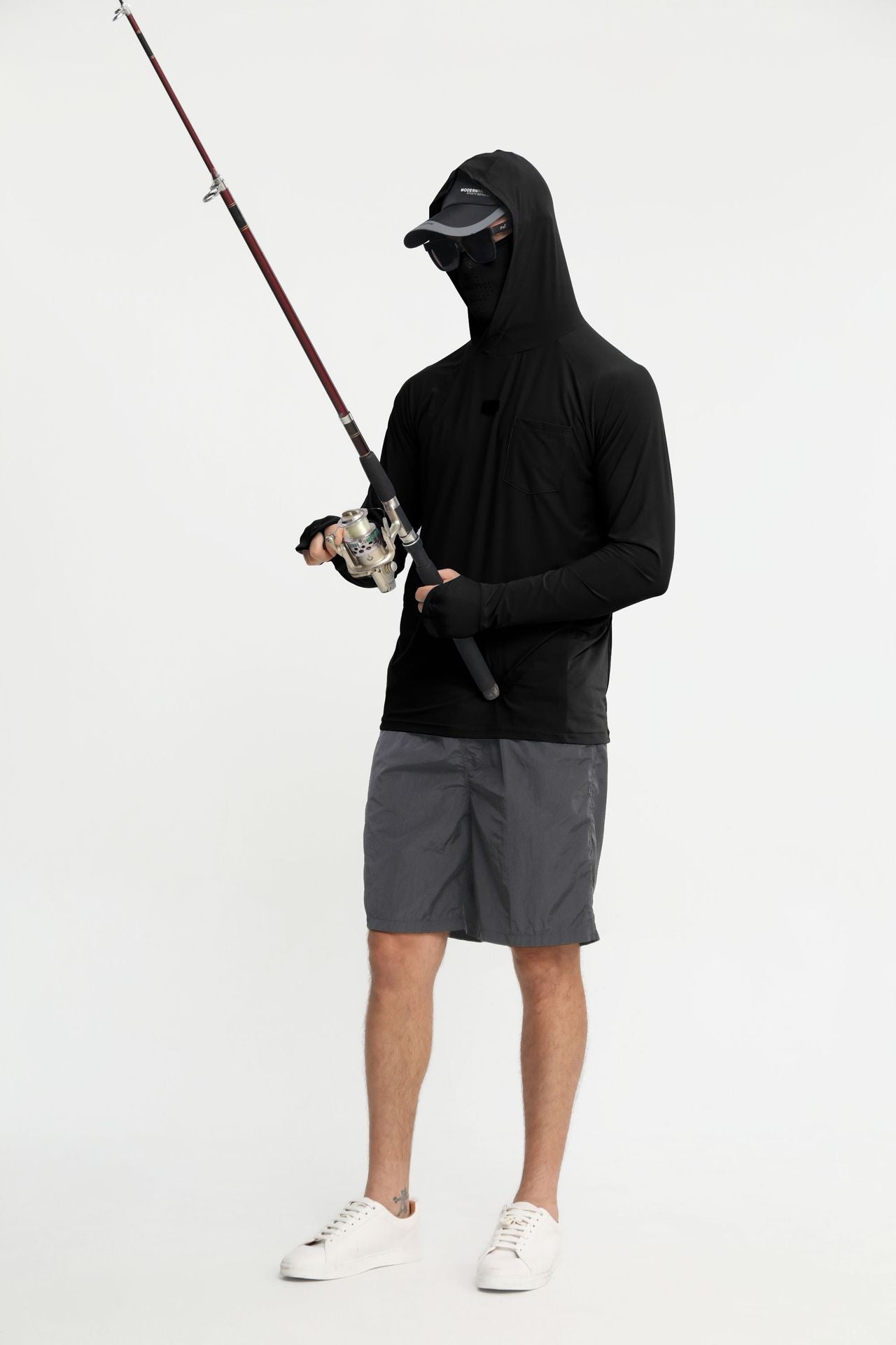 Quick-dry fishing sun hoodie in black with hood up and mesh face panel